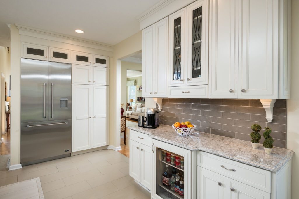 creamy pantry cabinet with fridge