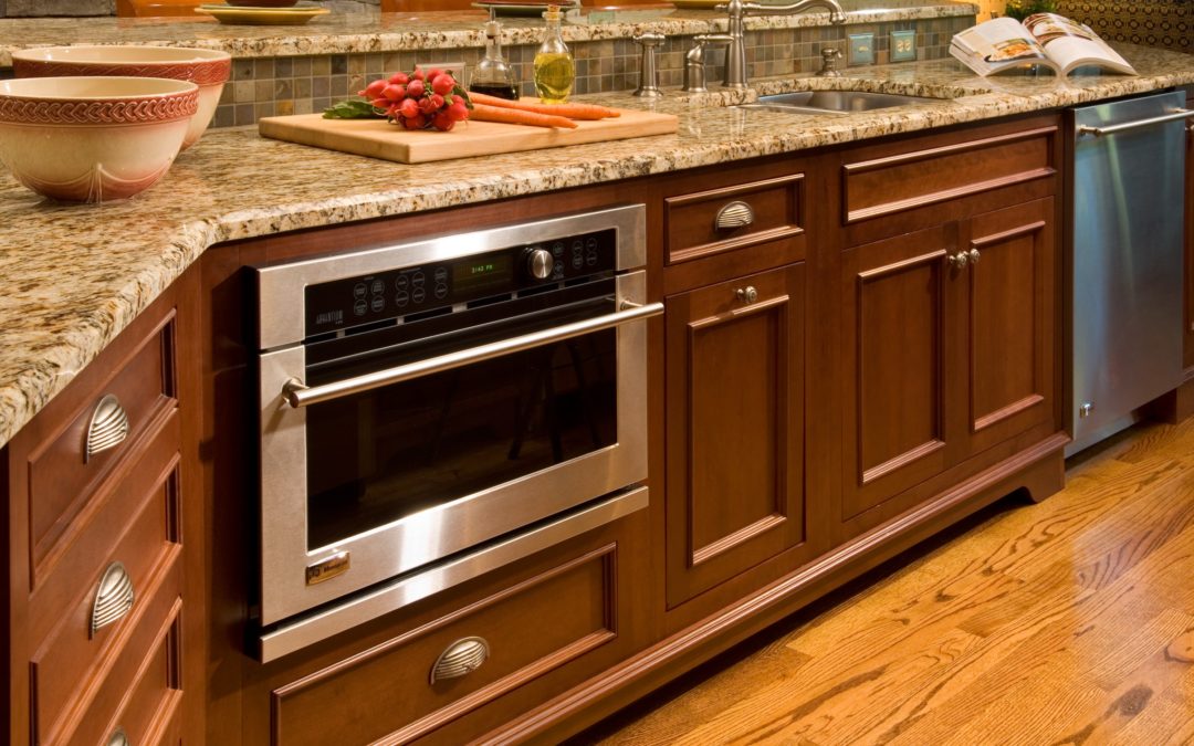 Close up of built in microwave in warm kitchen